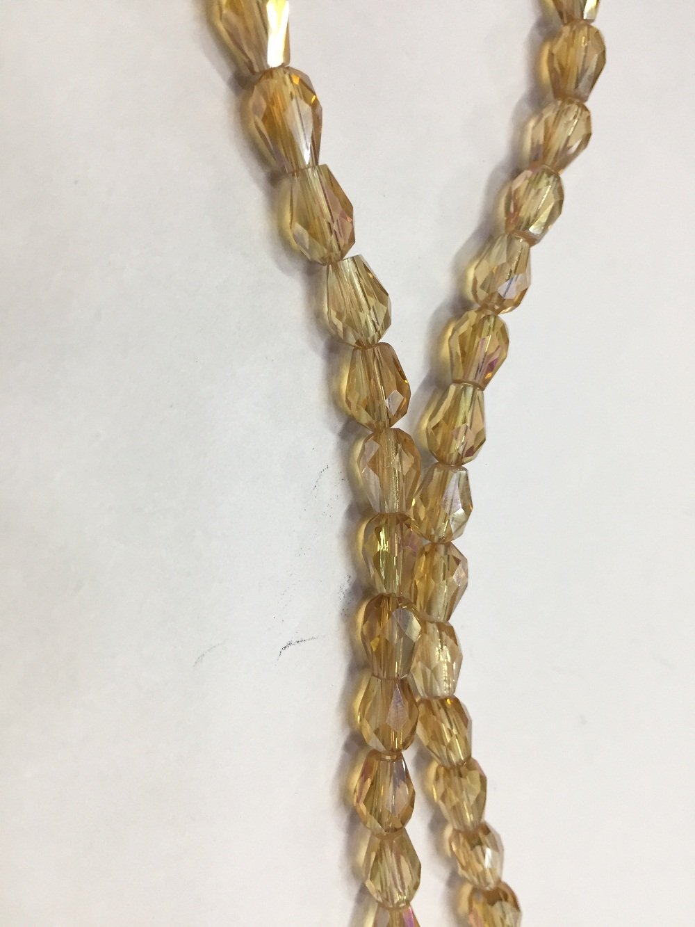 light-golden-transparent-drop-shaped-crystal-glass-beads