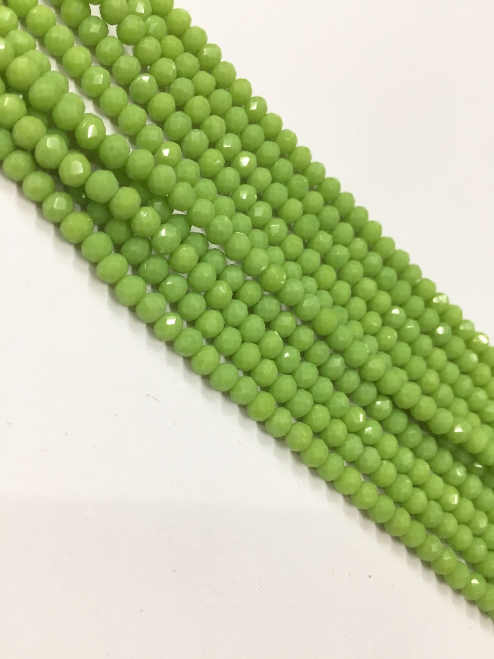 peridot-green-opaque-tyre-crystal-glass-beads