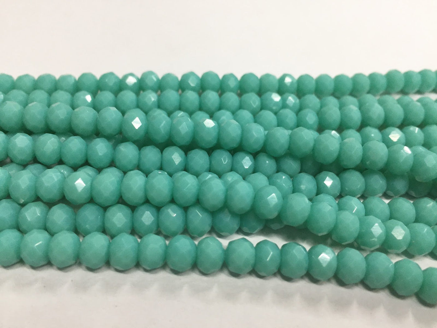 turquoise-blue-opaque-tyre-crystal-glass-beads