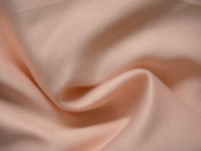 Pastel Peach Plain Malai Satin Fabric (Wholesale)