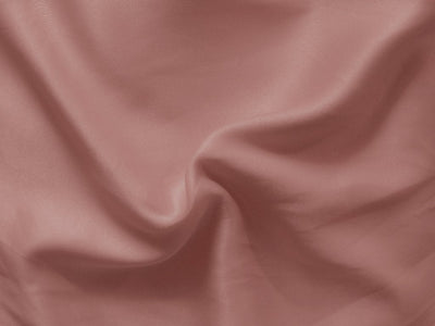 Pastel Dark Peach Plain Malai Satin Fabric (Wholesale)