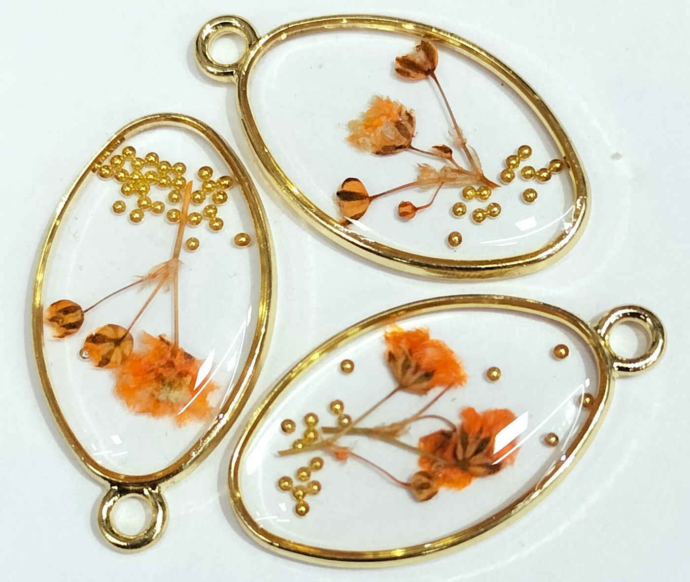 Orange & Golden Orange & Golden Oval Shaped Floral Design Resin Pendants with One Hole