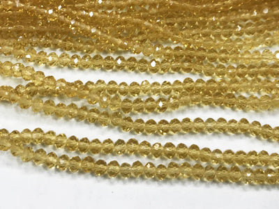 golden-transparent-tyre-glass-crystal-beads-4-mm