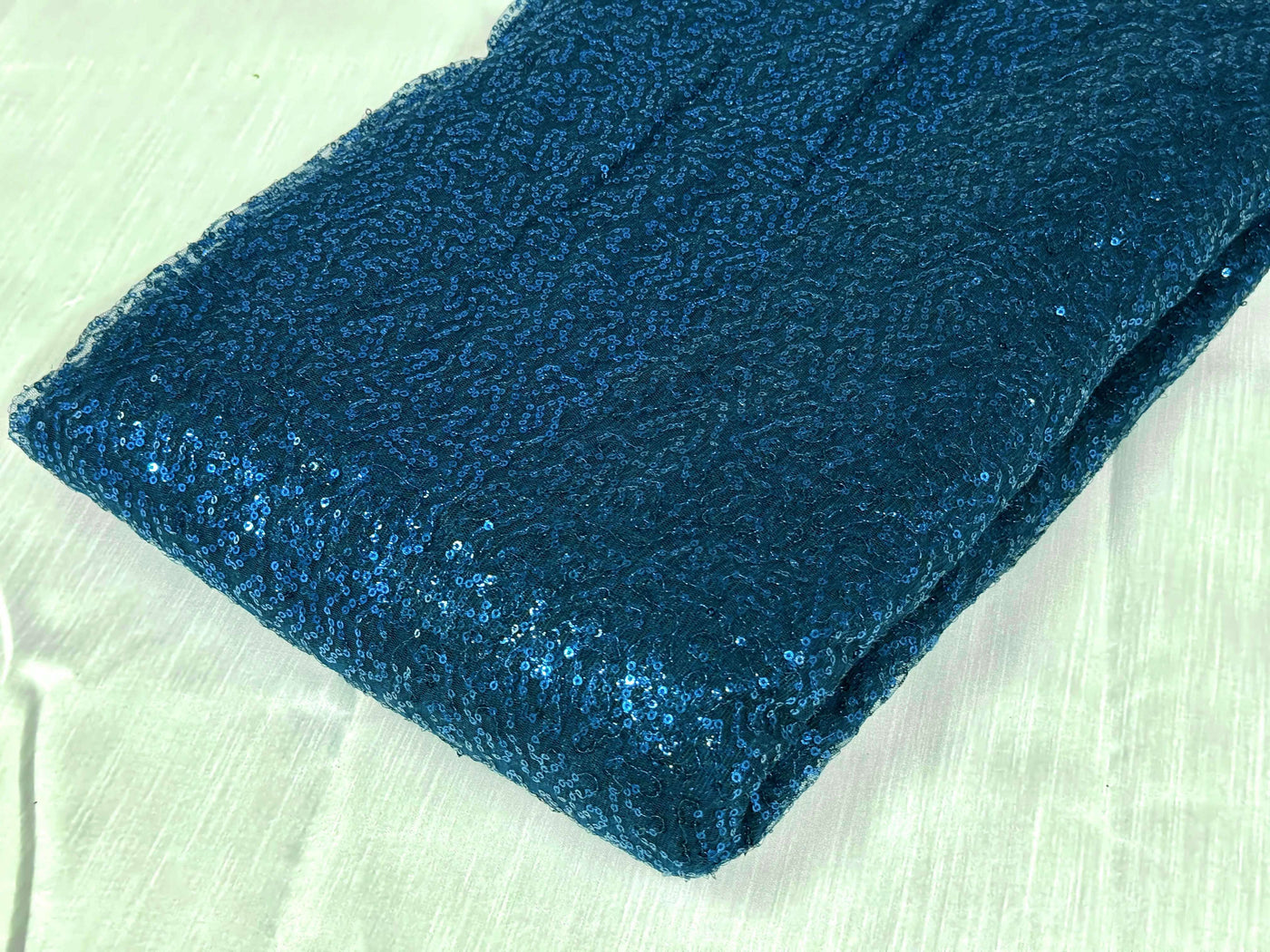 Peacock Blue Sequins Embroidered Net Fabric