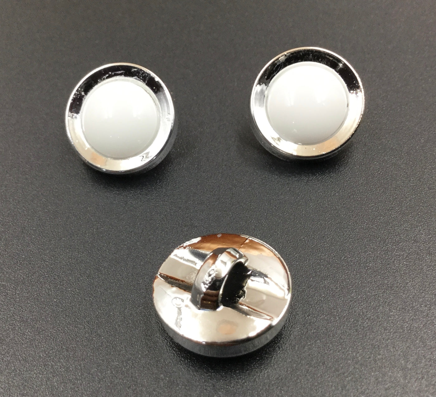 White & Silver Circular Plastic Buttons