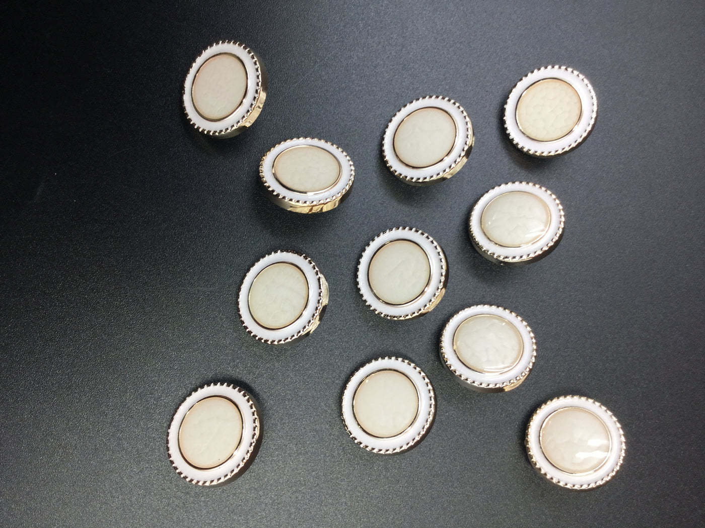 White & Golden Circular Plastic Button