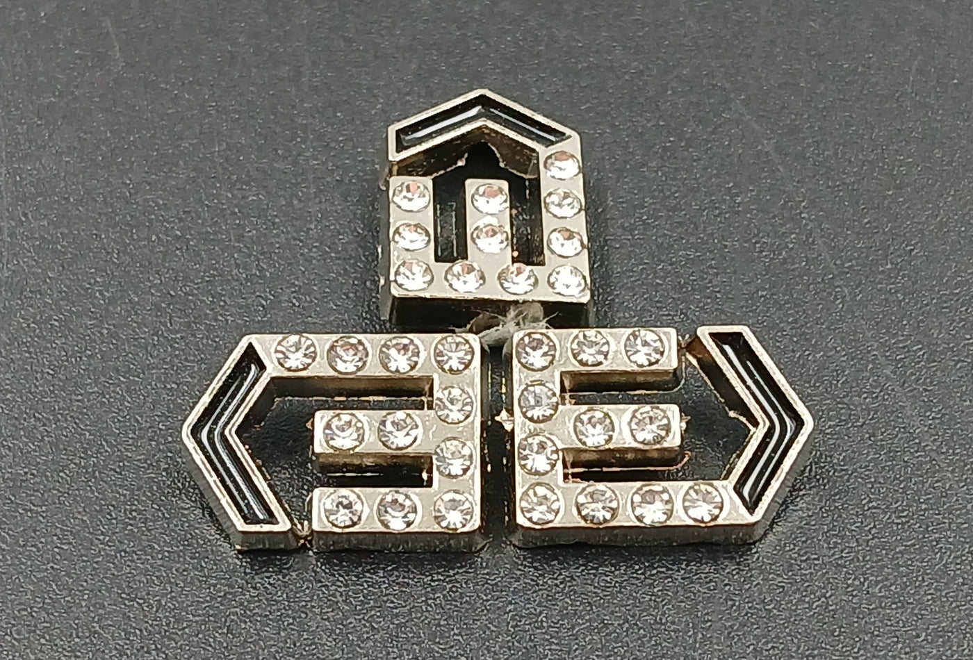 Silver With Black E Shape Badges