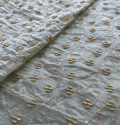 White & Golden Motifs Beads And Sequins Hand Embroidered Pastel Green Crushed Tissue Silk Fabric