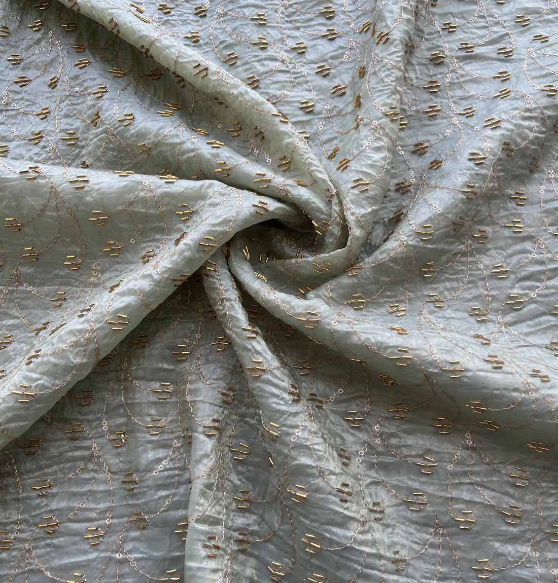 White & Golden Motifs Beads And Sequins Hand Embroidered Pastel Green Crushed Tissue Silk Fabric