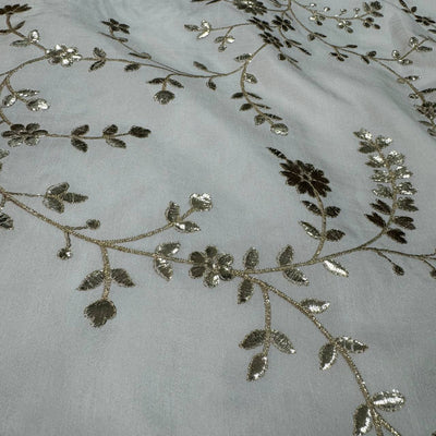 White Floral Dyeable Zari Foil Embroidered Viscose Dola Silk Fabric