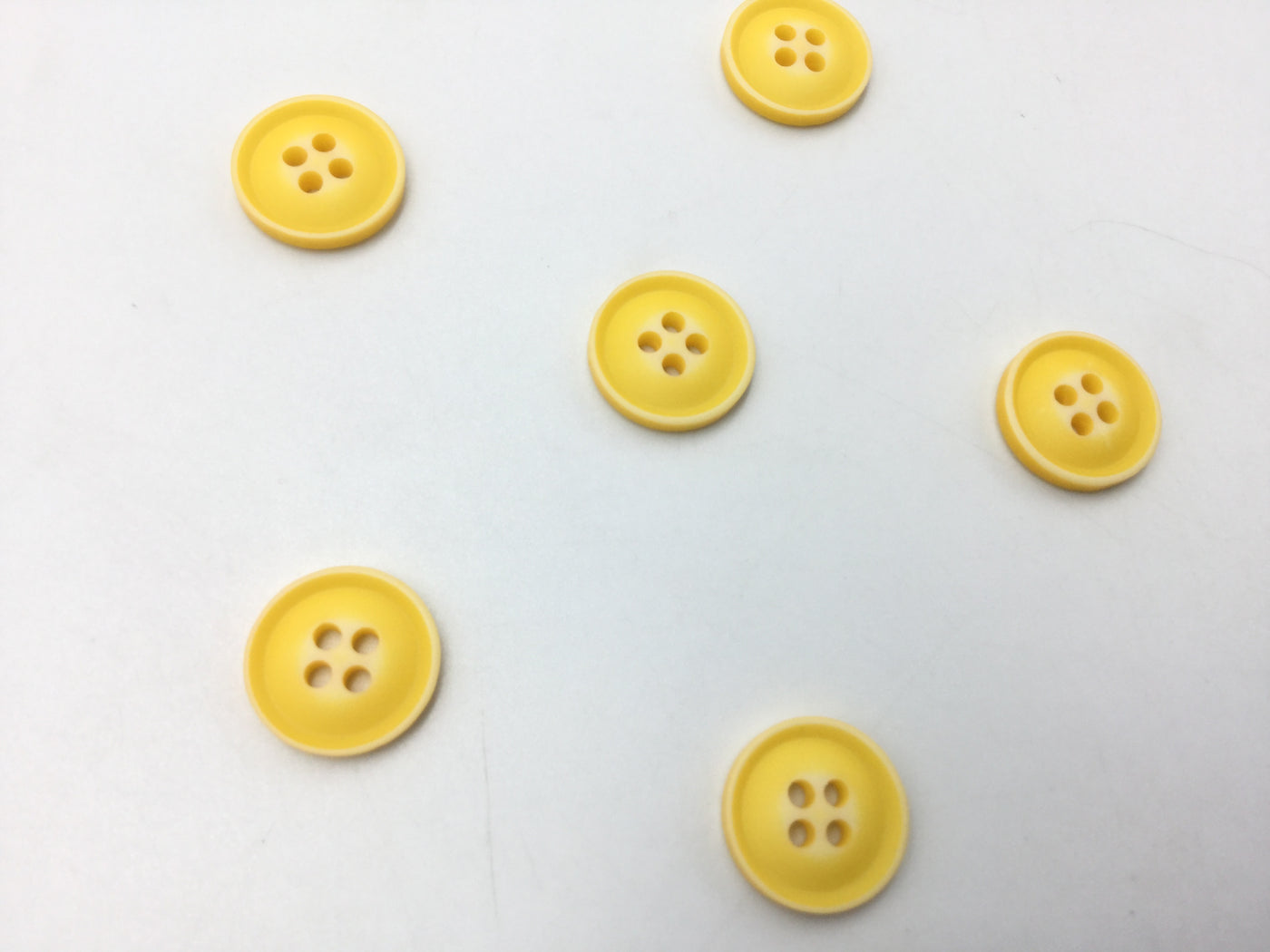 Yellow Circular Plastic Buttons