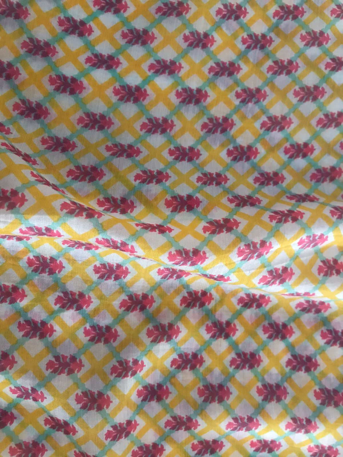 viscose-muslin-silk-pink-floral-motif-yellow-cross-pattern-print-fabric