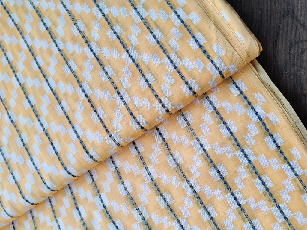 yellow-geometric-self-patterned-ikkat-cotton-fabric