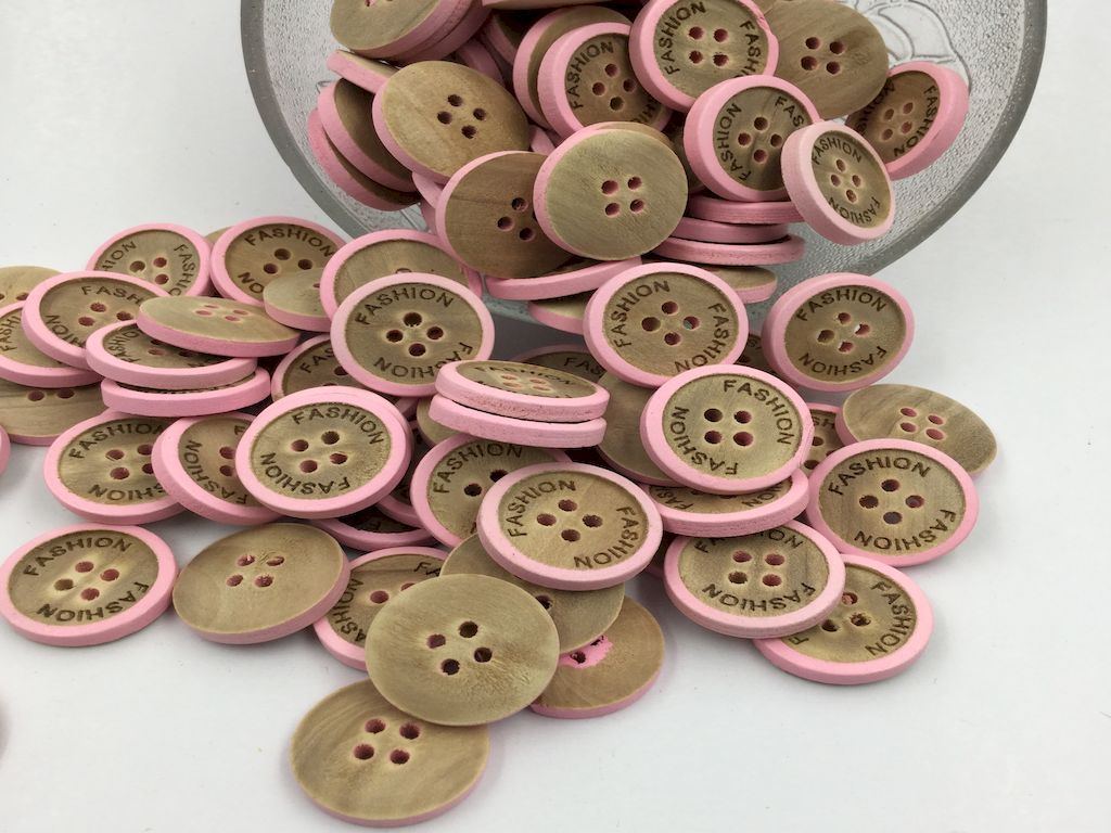 32l-round-shaped-wooden-button-with-four-holes-and-pink-touch-on-it