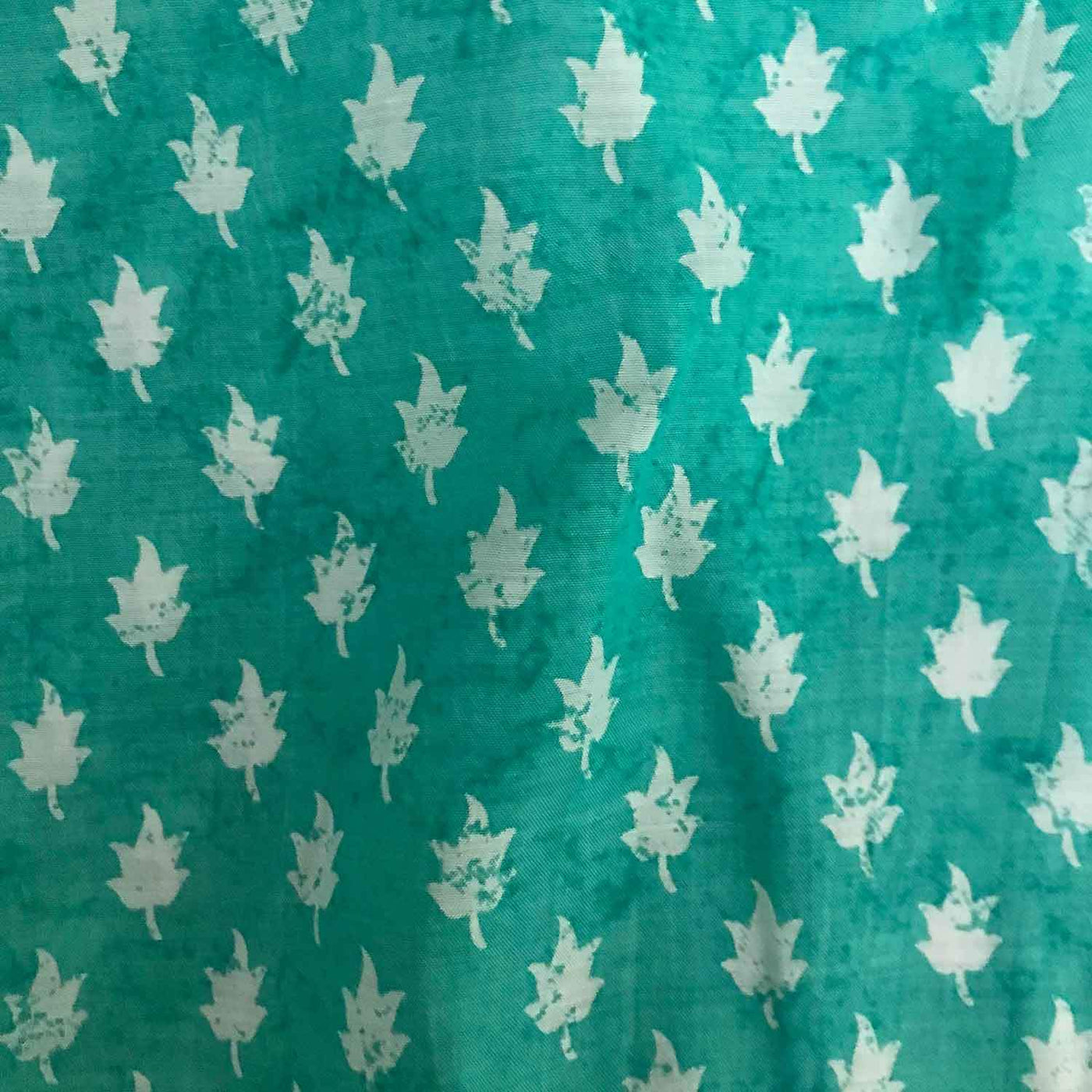 white-leaves-teal-blue-viscose-muslin-fabric