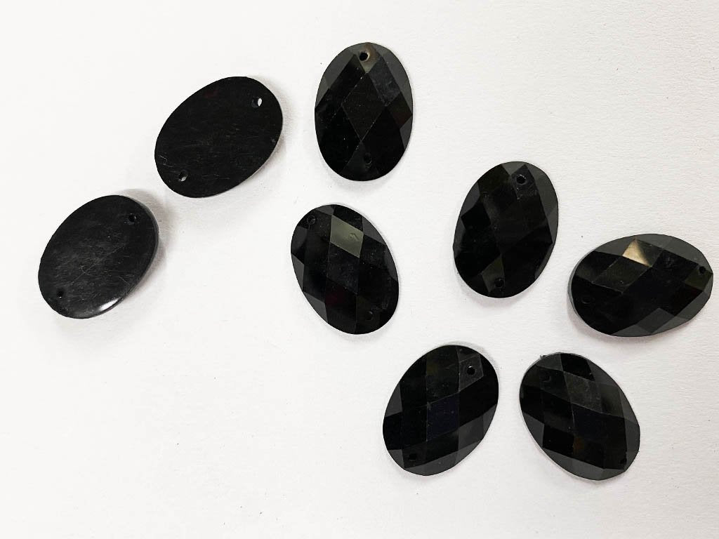 black-oval-2-hole-plastic-beads-18x13-mm