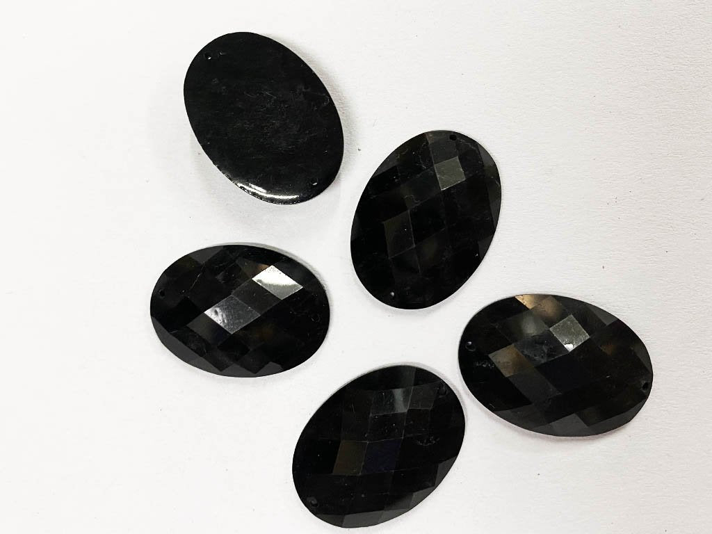 black-oval-2-hole-plastic-beads-18x25-mm