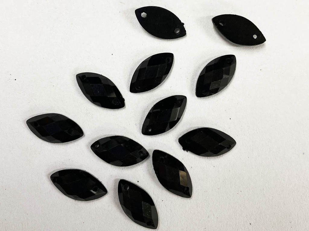 black-eye-2-hole-plastic-beads-6x12-mm