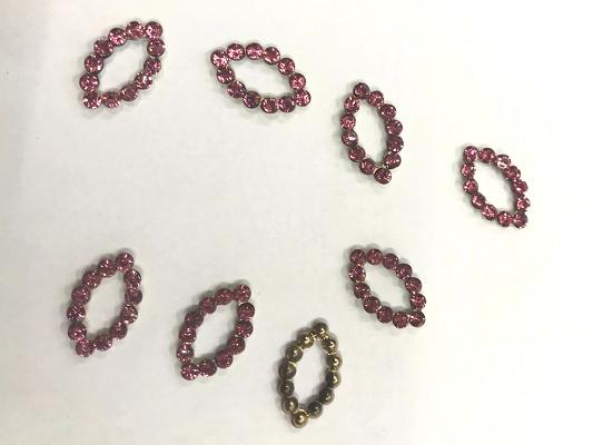 pink-stone-studded-eye-metal-embellishment-with-iron-base