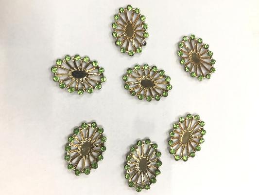 green-oval-stone-studded-metal-embellishment-with-iron-base