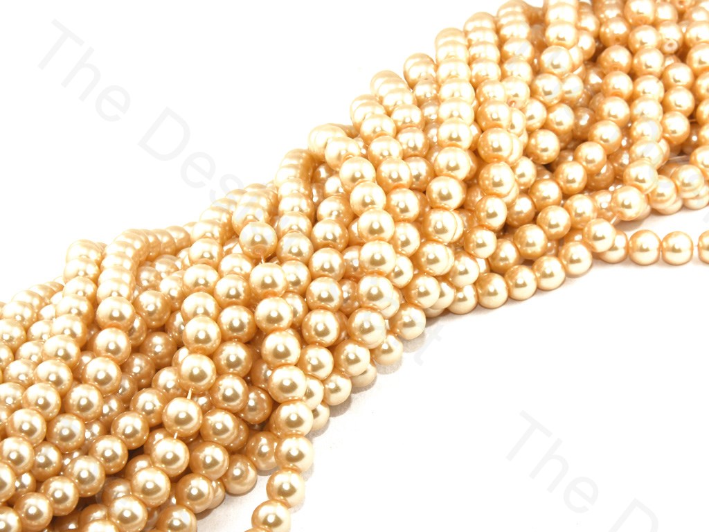 golden-spherical-glass-pearl (12421129555)