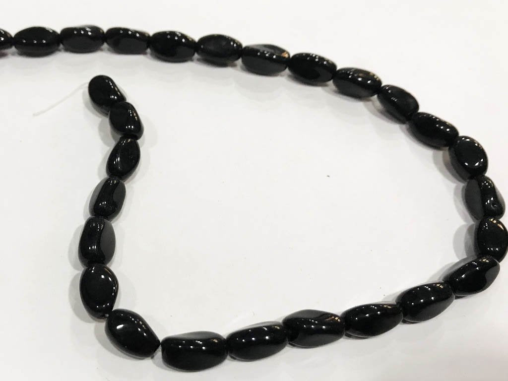 black-fancy-oval-pressed-glass-beads-8x12-mm