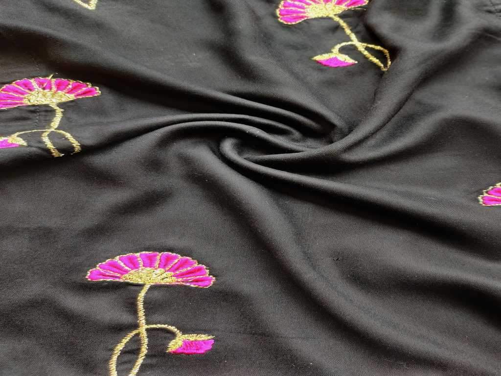black-rayon-fabric-with-embroidered-pink-flowers-all-over