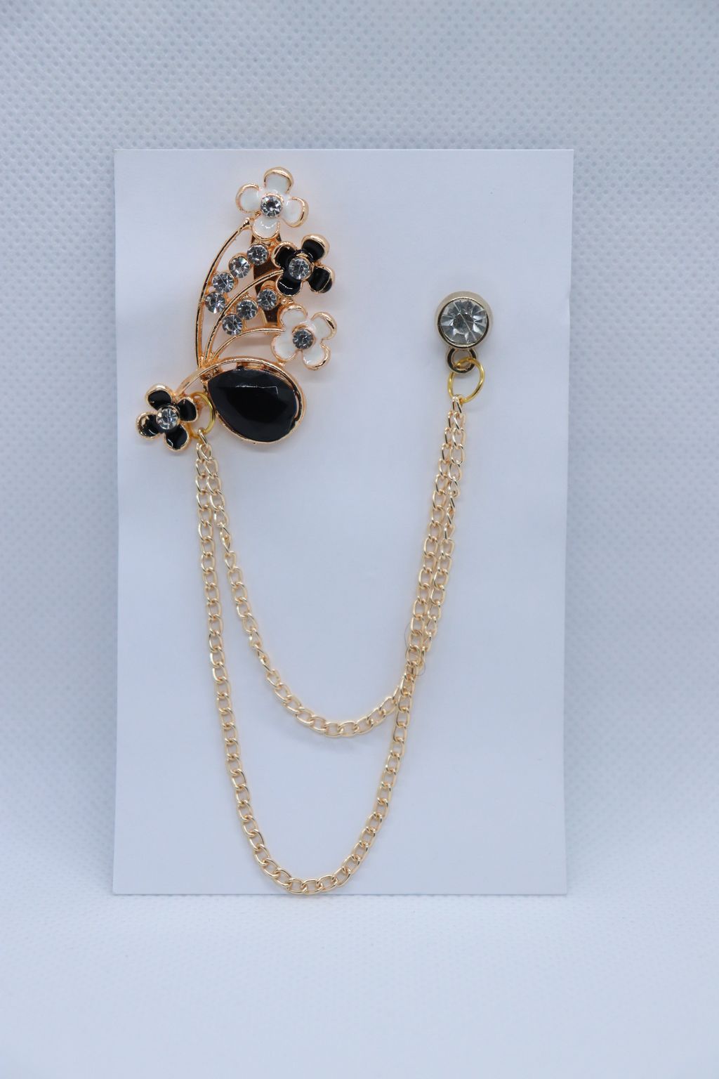 black-stone-with-white-flower-brooch