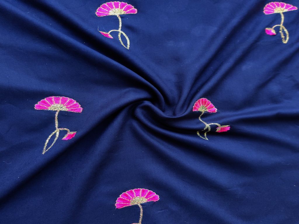 blue-rayon-fabric-with-embroidered-pink-flowers-all-over