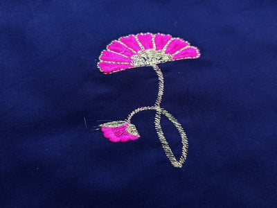 blue-rayon-fabric-with-embroidered-pink-flowers-all-over