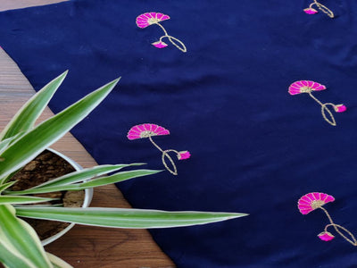 blue-rayon-fabric-with-embroidered-pink-flowers-all-over