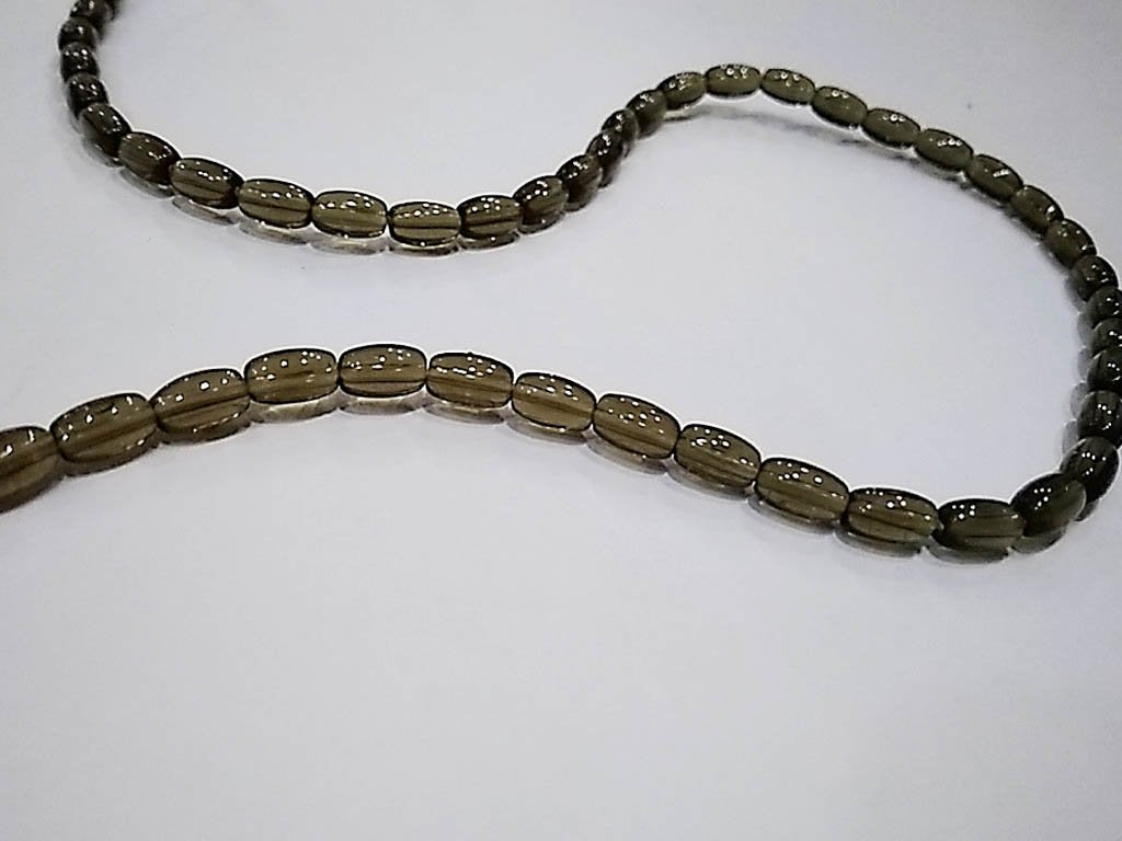 brown-transparent-oval-pressed-glass-beads-4x7-mm