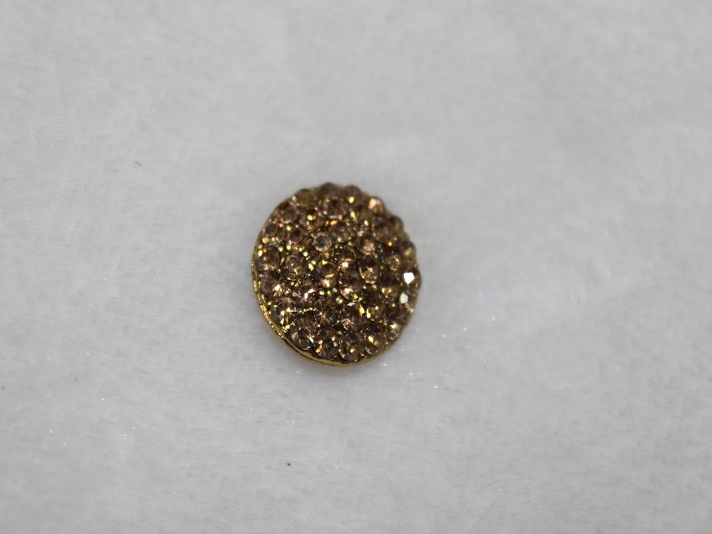 circular-golden-stone-metal-button