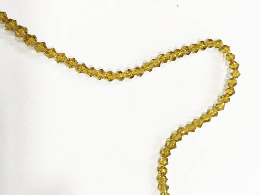 golden-new-cut-cross-cut-pressed-glass-beads-4-mm