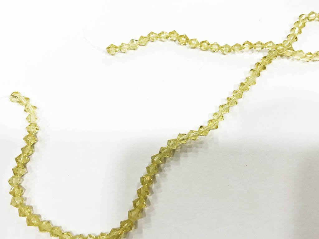 golden-transparent-new-cut-cross-cut-pressed-glass-beads-4-mm