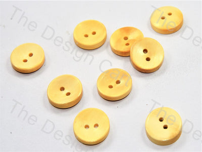pressed-curve-design-yellow-wooden-buttons