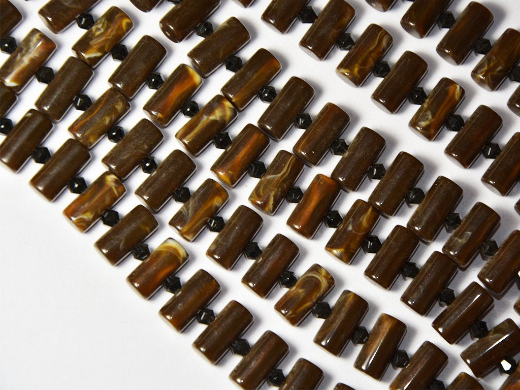dark-brown-cylindrical-resin-beads