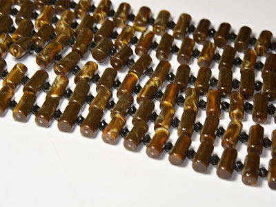 dark-brown-cylindrical-resin-beads