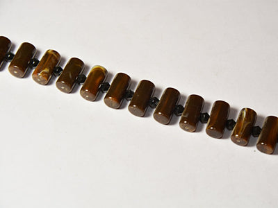 dark-brown-cylindrical-resin-beads
