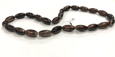 dark-brown-oval-glass-beads