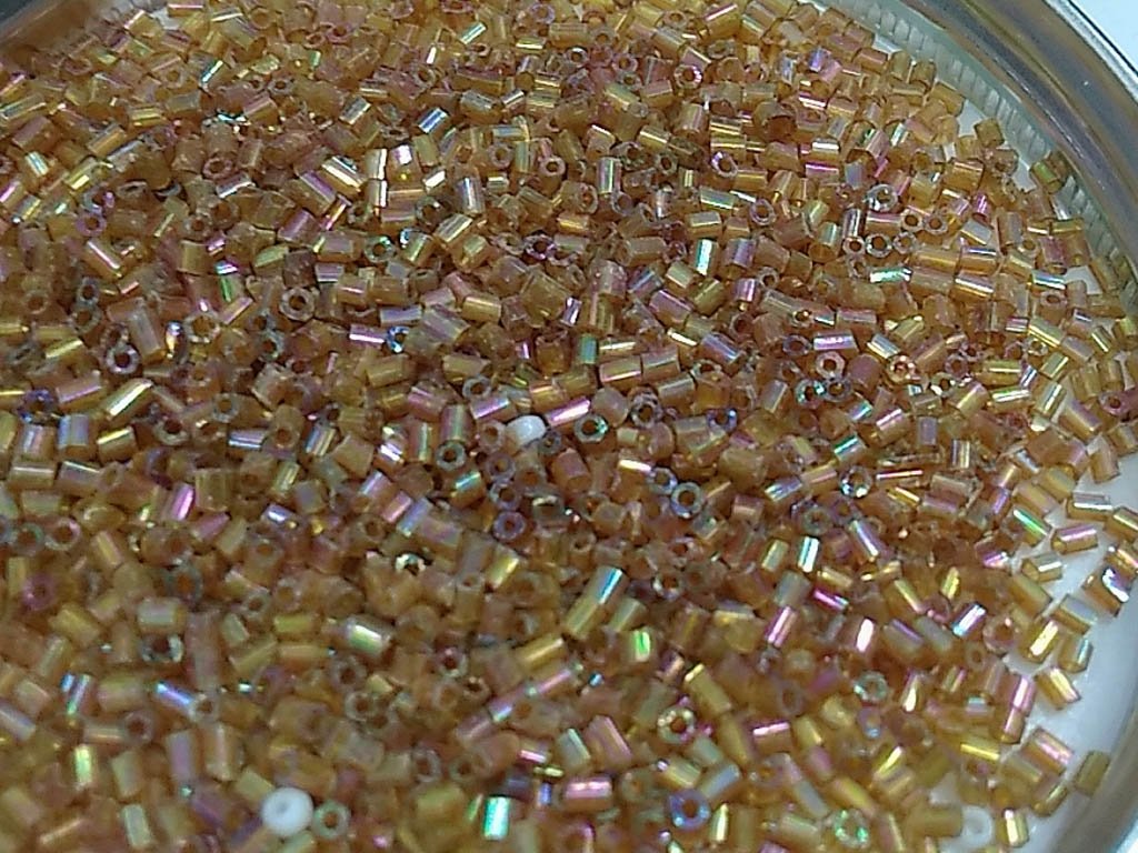 dark-golden-transparent-rainbow-2-cut-glass-seed-beads