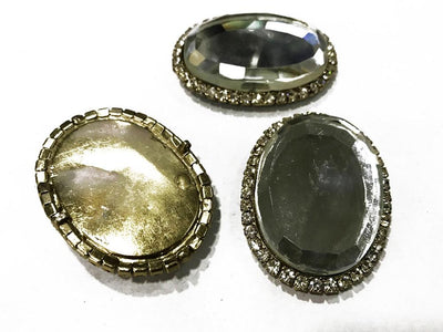 dark-gray-oval-metal-embellishment-with-crystal-frame-35x48-mm