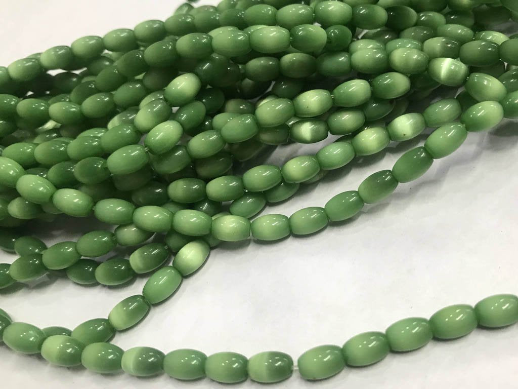 dark-green-oval-pressed-glass-beads-5x8-mm