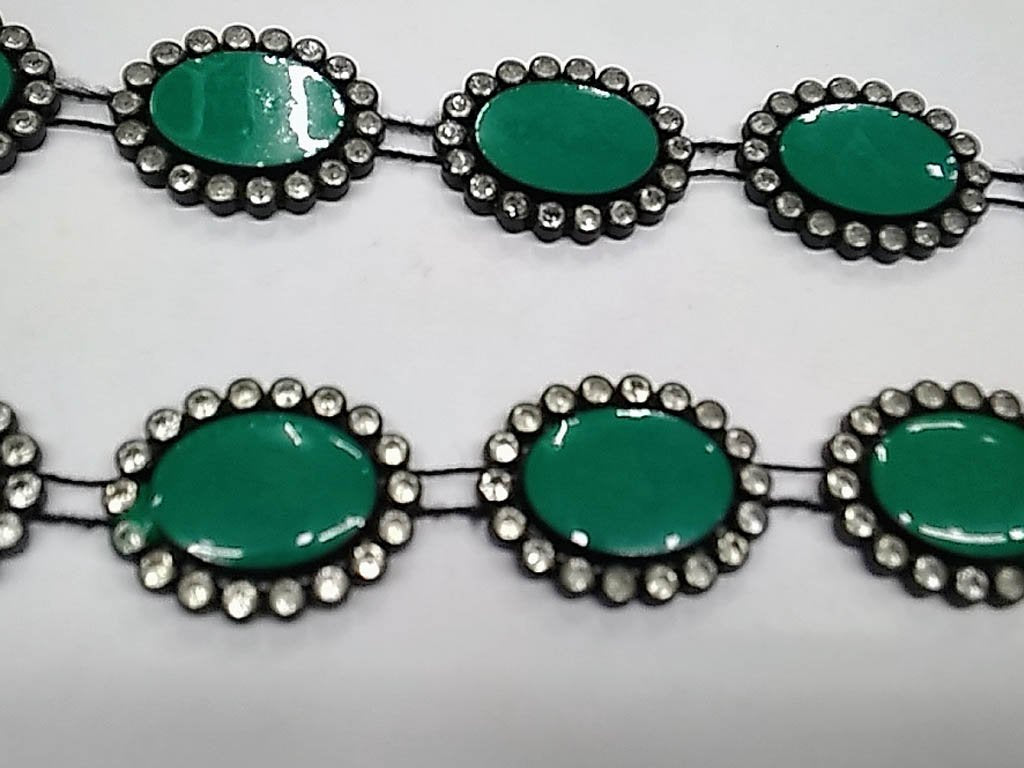 dark-green-oval-stone-studded-plastic-lace-with-enamel-fill-18x13-mm