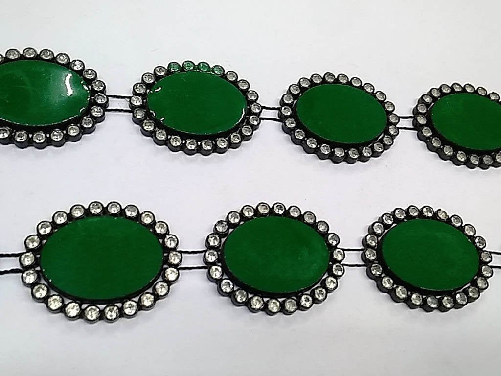 dark-green-oval-stone-studded-plastic-lace-with-enamel-fill-25x18-mm