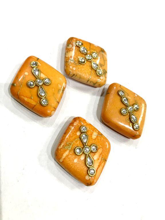 designer-orange-kite-shaped-show-buttons