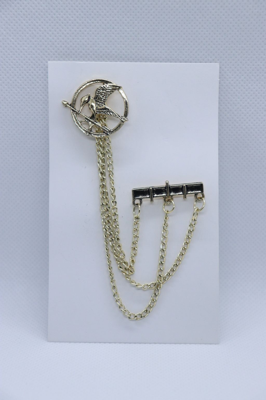 golden-bird-with-arrow-metallic-brooch