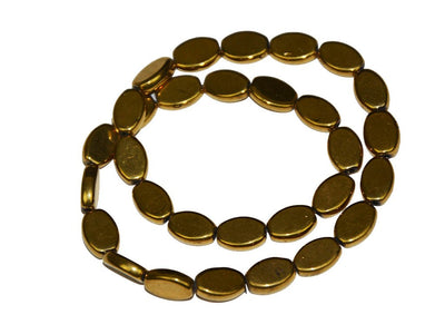 golden-flat-oval-glass-beads