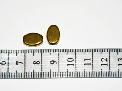 golden-flat-oval-glass-beads