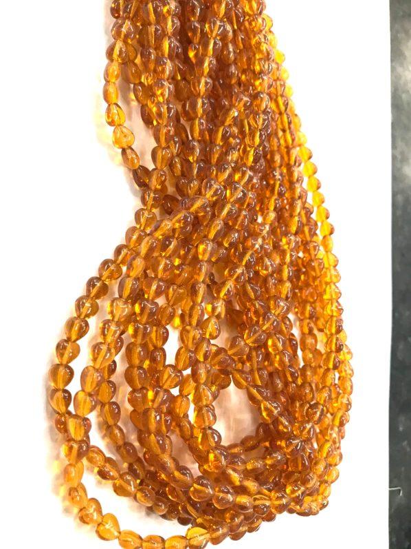 golden-heart-shaped-tansparent-pressed-beads